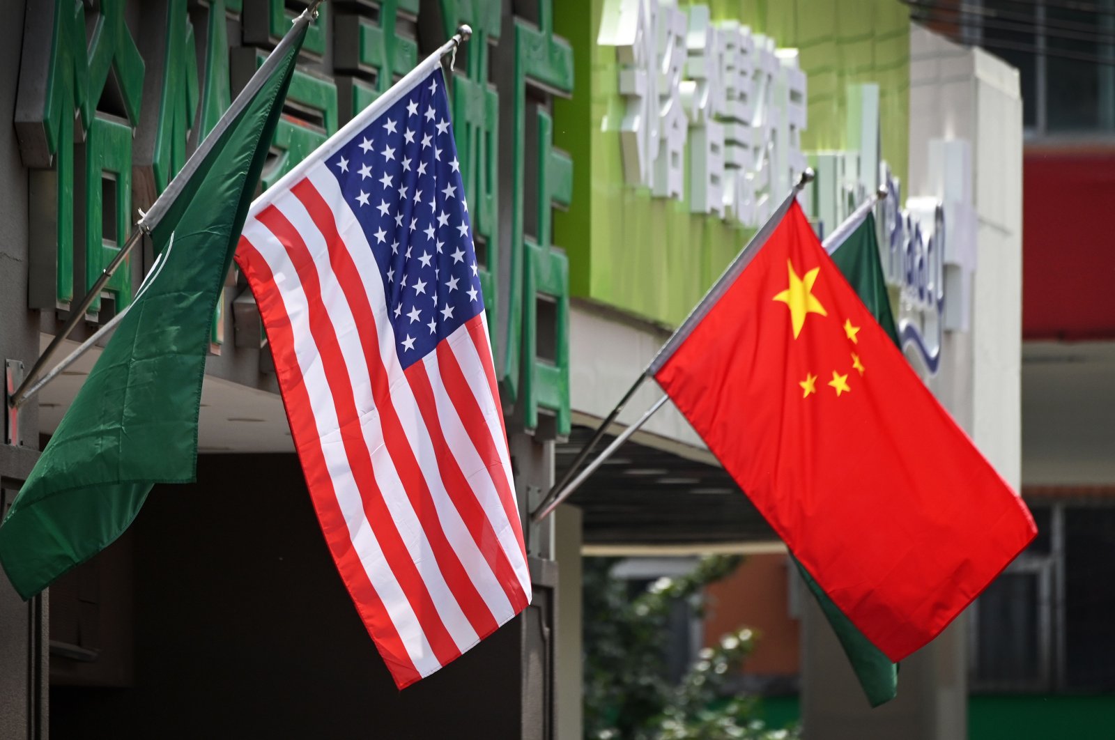 This file photo taken on May 14, 2019 shows the US (L) and Chinese flags displayed outside a hotel in Beijing. (AFP Photo)