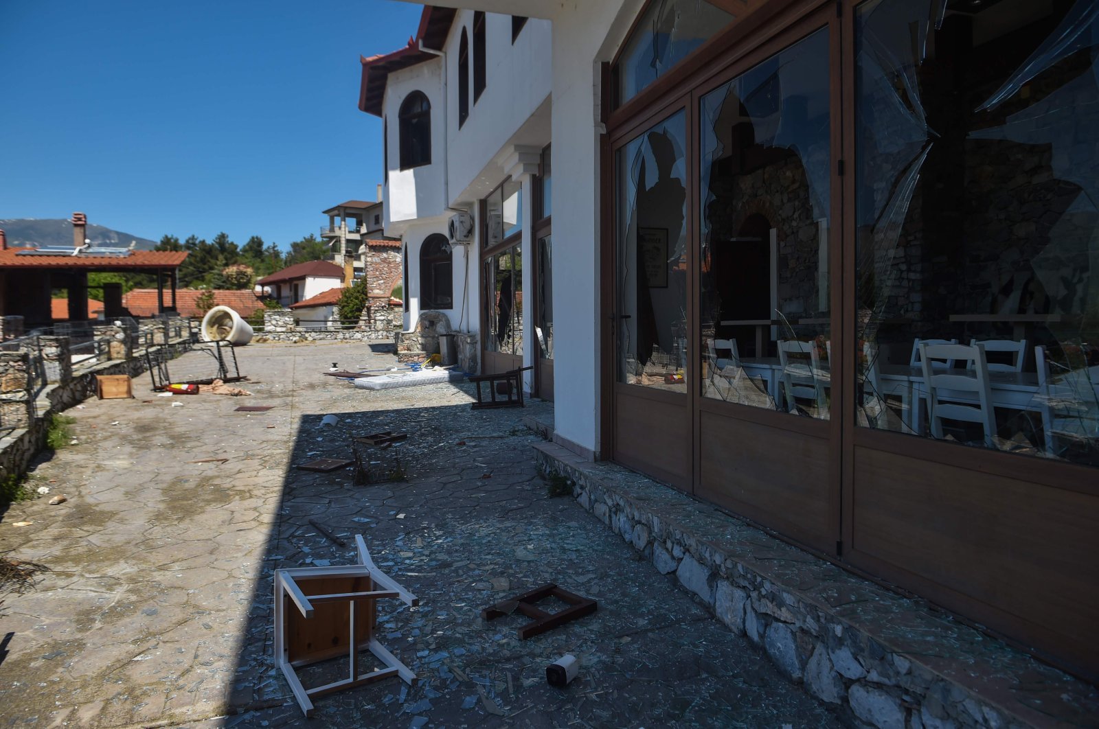 View of the damage on May 8, 2020, caused by some 250 protestors who ransacked a hotel to prevent the settlement of 57 refugee families on May 4, in the village of Arnissa, 560km north from Athens. (AFP Photo)