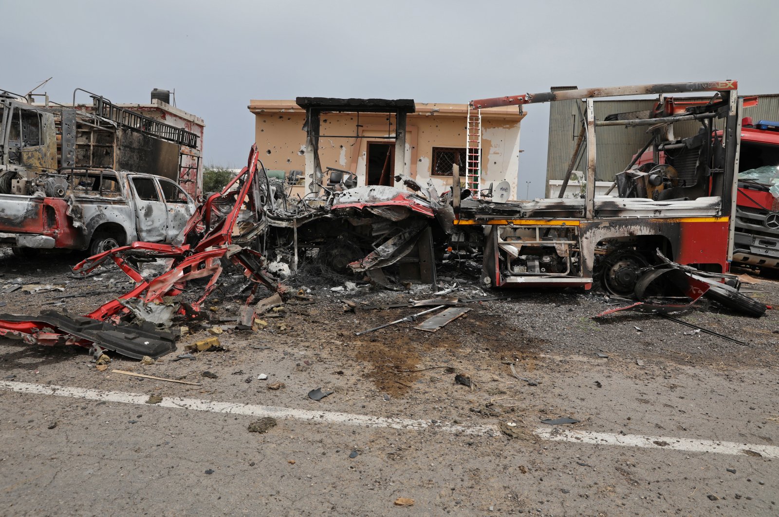Damaged vehicles are seen at Tripoli's Mitiga airport after it was hit by shelling in Tripoli, Libya, May 10, 2020. (REUTERS Photo)