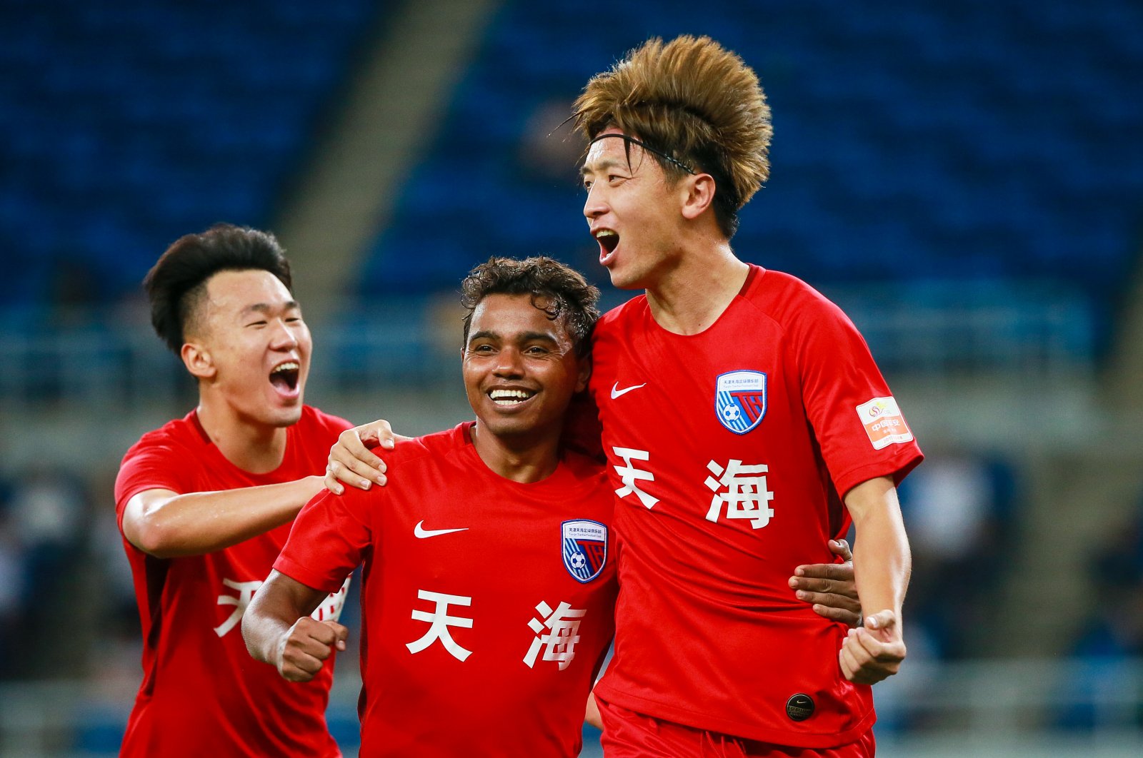 Tianjin Tianhai F.C players celebrate a goal at the 22nd round match of the 2019 Chinese Football Association Super League (CSL) in Tianjin, China, Aug. 15, 2019. (Reuters Photo)