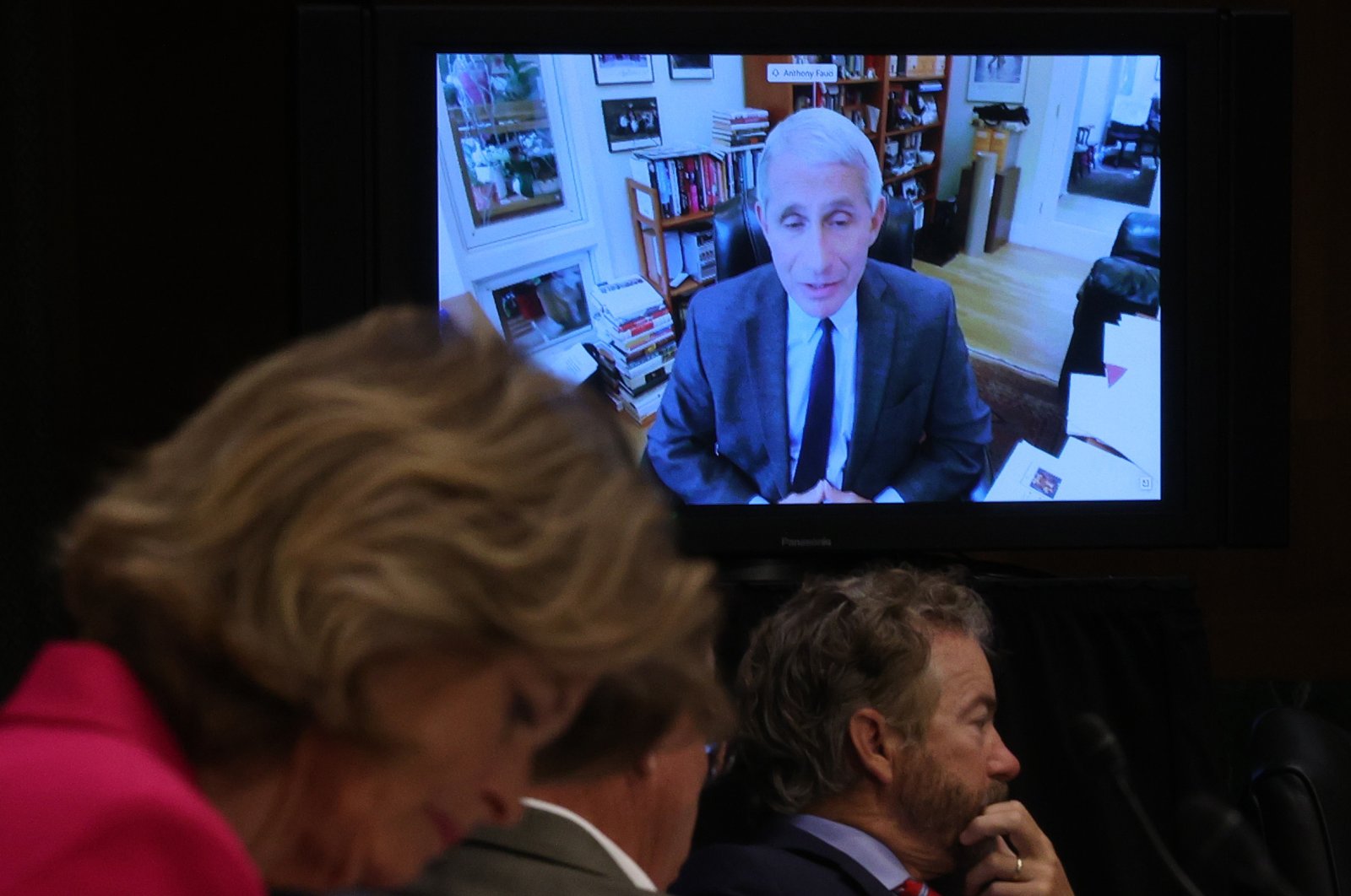 Senators listen to Dr. Anthony Fauci, director of the National Institute of Allergy and Infectious Diseases speak remotely during a Senate committee meeting, Washington, May 12, 2020. (AFP Photo)