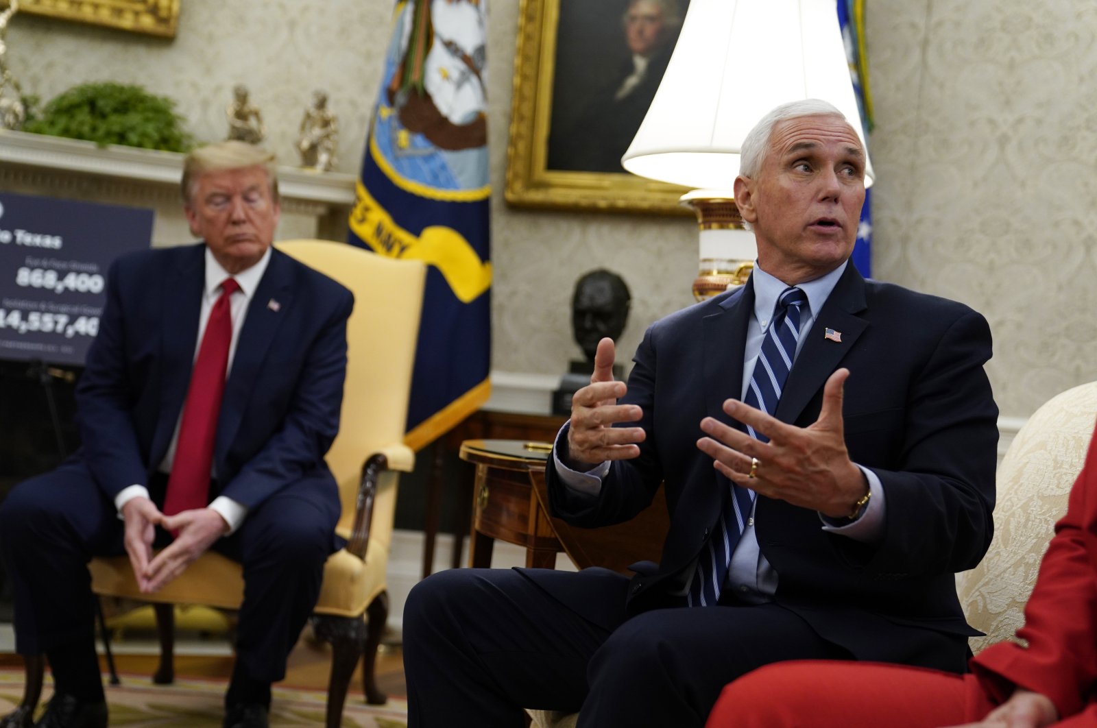 U.S. President Donald Trump listens as Vice President Mike Pence speaks during a meeting about the coronavirus response with Gov. Greg Abbott, R-Texas, in the Oval Office of the White House, Thursday, May 7, 2020, in Washington. (AP Photo)