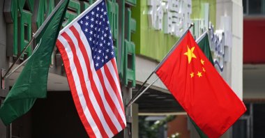 U.S. and Chinese flags displayed outside a hotel in Beijing, China, May 14, 2019. (AFP Photo)