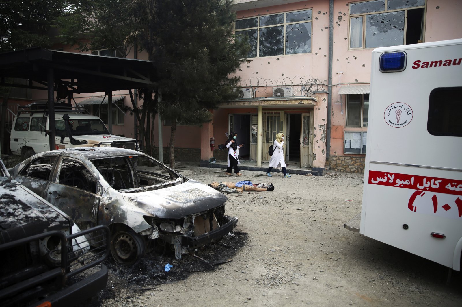 A body of a militant killed during an attack lies on the ground at a maternity hospital in Kabul, Afghanistan, Tuesday, May 12, 2020. (AP Photo)