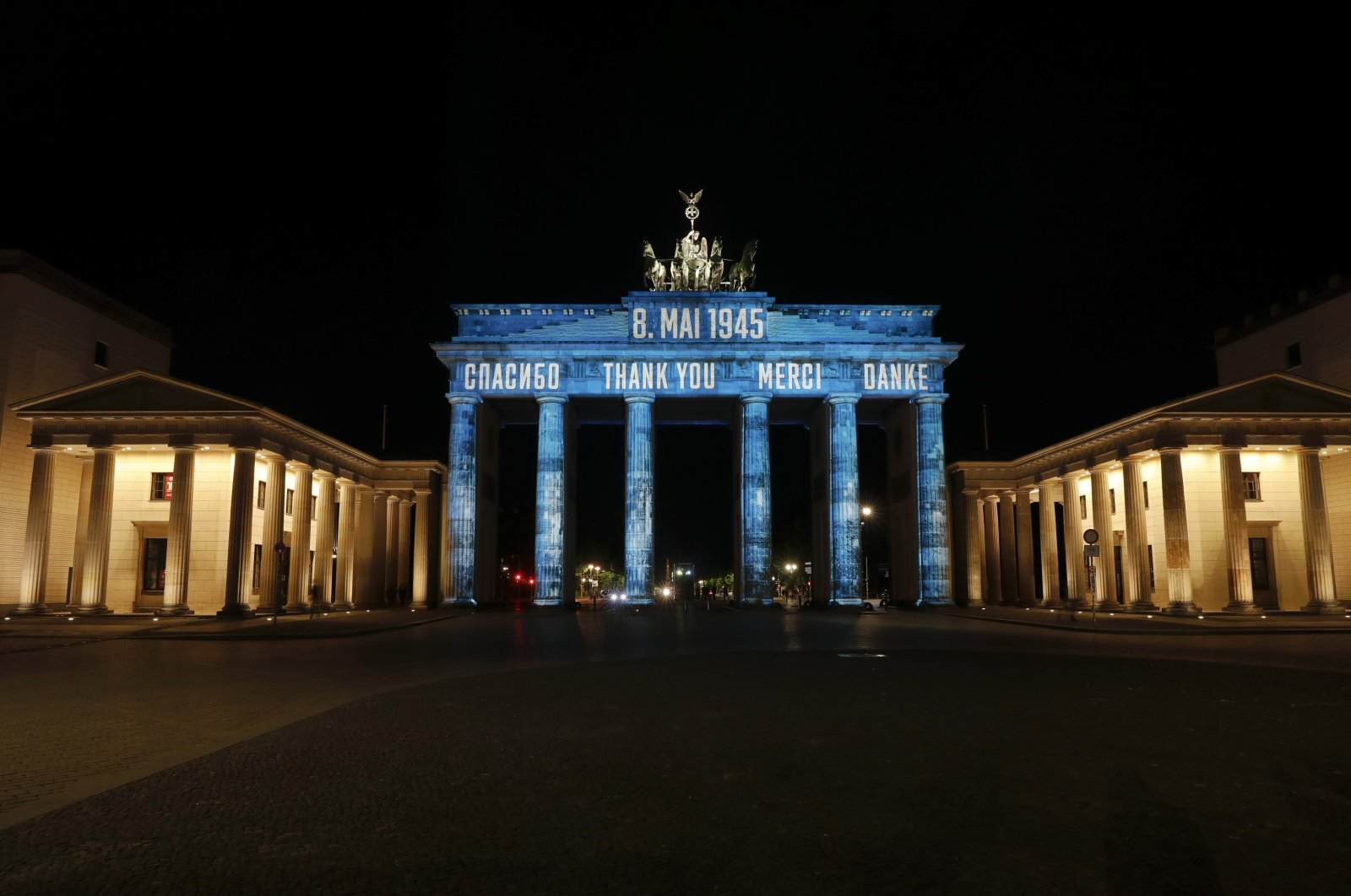 The German landmark Brandenburg Gate is illuminated to mark the 75th anniversary of Victory Day and the end of World War II in Europe, Berlin, Germany, May 8, 2020. (AP Photo)