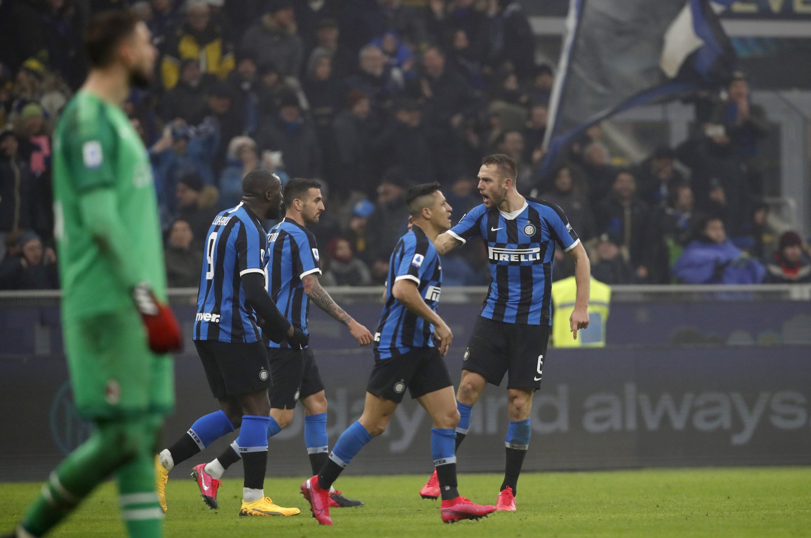 Inter Milan players celebrate a goal during a Serie A match against AC Milan, in Milan, Italy, Feb. 9, 2020. (AP Photo)