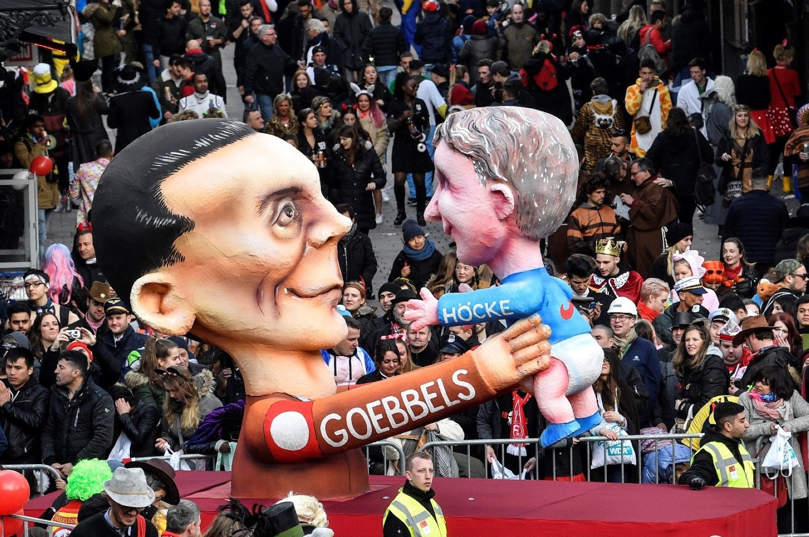 A carnival float depicts Nazi propaganda minister Joseph Goebbels holding AfD right-wing politician Bjoern Hoecke during the traditional carnival parade in Duesseldorf, Germany, March 4, 2019. (AP Photo)