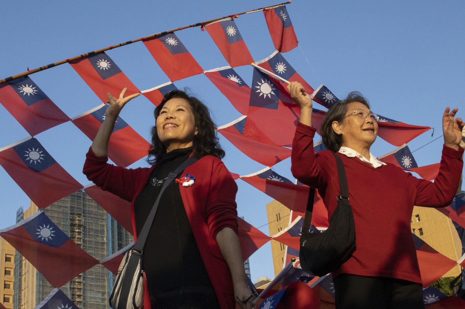 Supporters of the Nationalist or KMT party pose with the Taiwanese flag during a rally for the presidential election in Taipei, Taiwan, Jan. 9, 2020. (AP Photo)