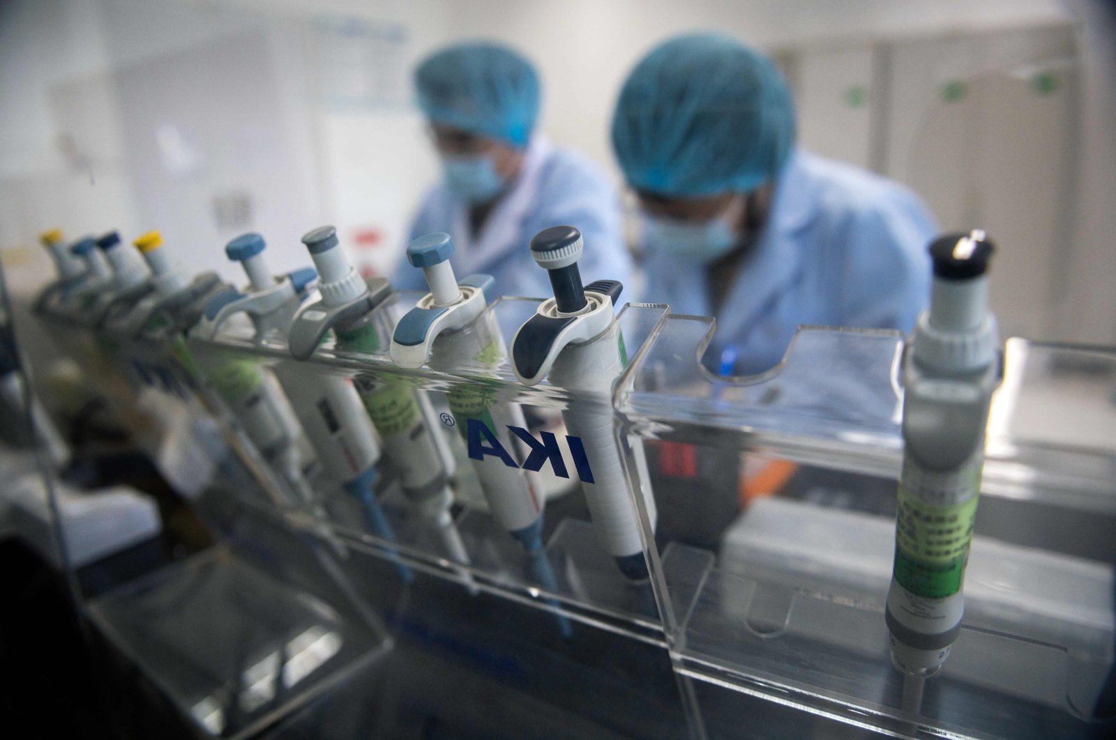 Workers are seen inside the Beijing Applied Biological Technologies (XABT) research and development laboratory, Beijing, May 14, 2020. (AFP Photo)