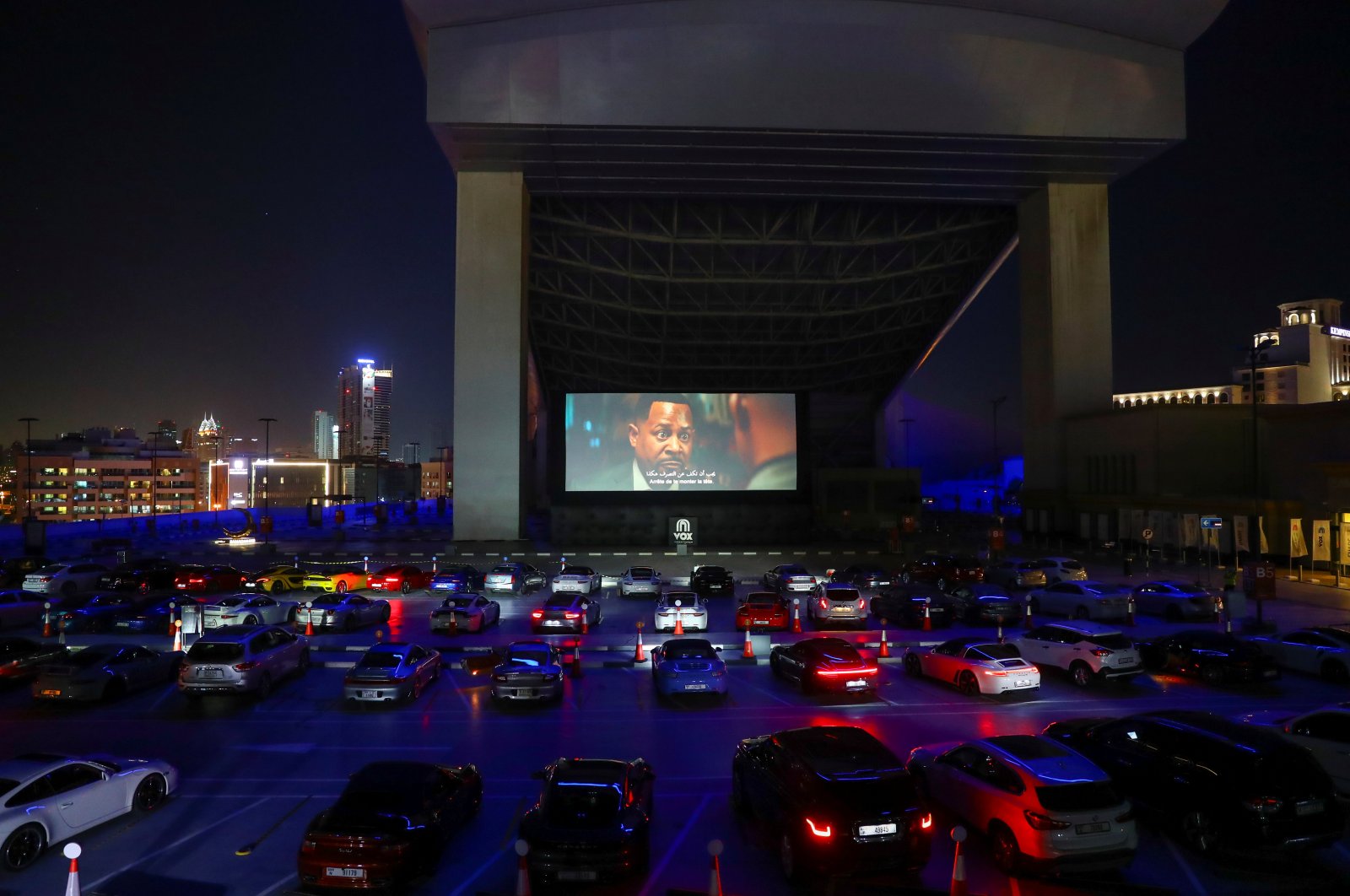People sit in their cars watching a movie in a drive-in cinema at the Mall of the Emirates during the COVID-19 outbreak, in Dubai, the United Arab Emirates, May 13, 2020. (REUTERS Photo)