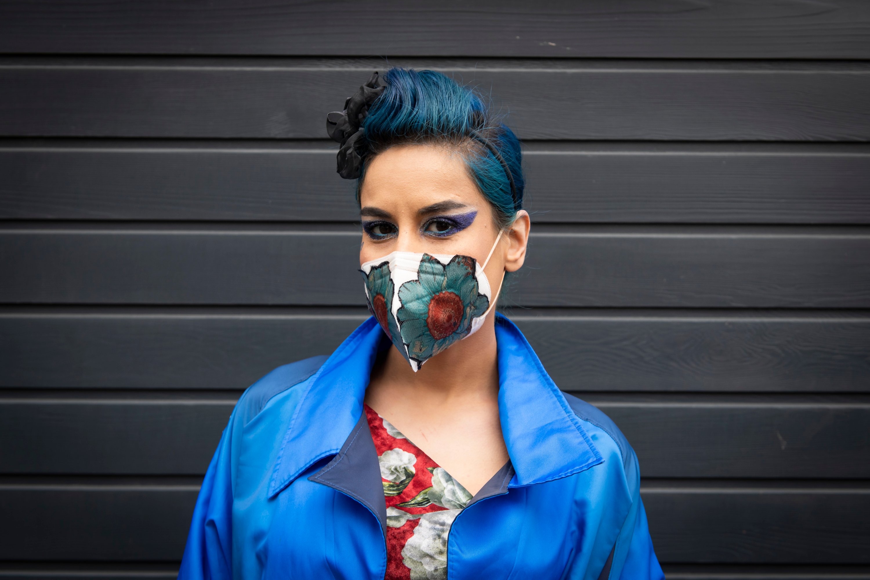 Fashion stylist Lily Moo wears her personally designed face mask during the Coronavirus outbreak, Victoria, London. (David Jensen/EMPICS Entertainment via Reuters)