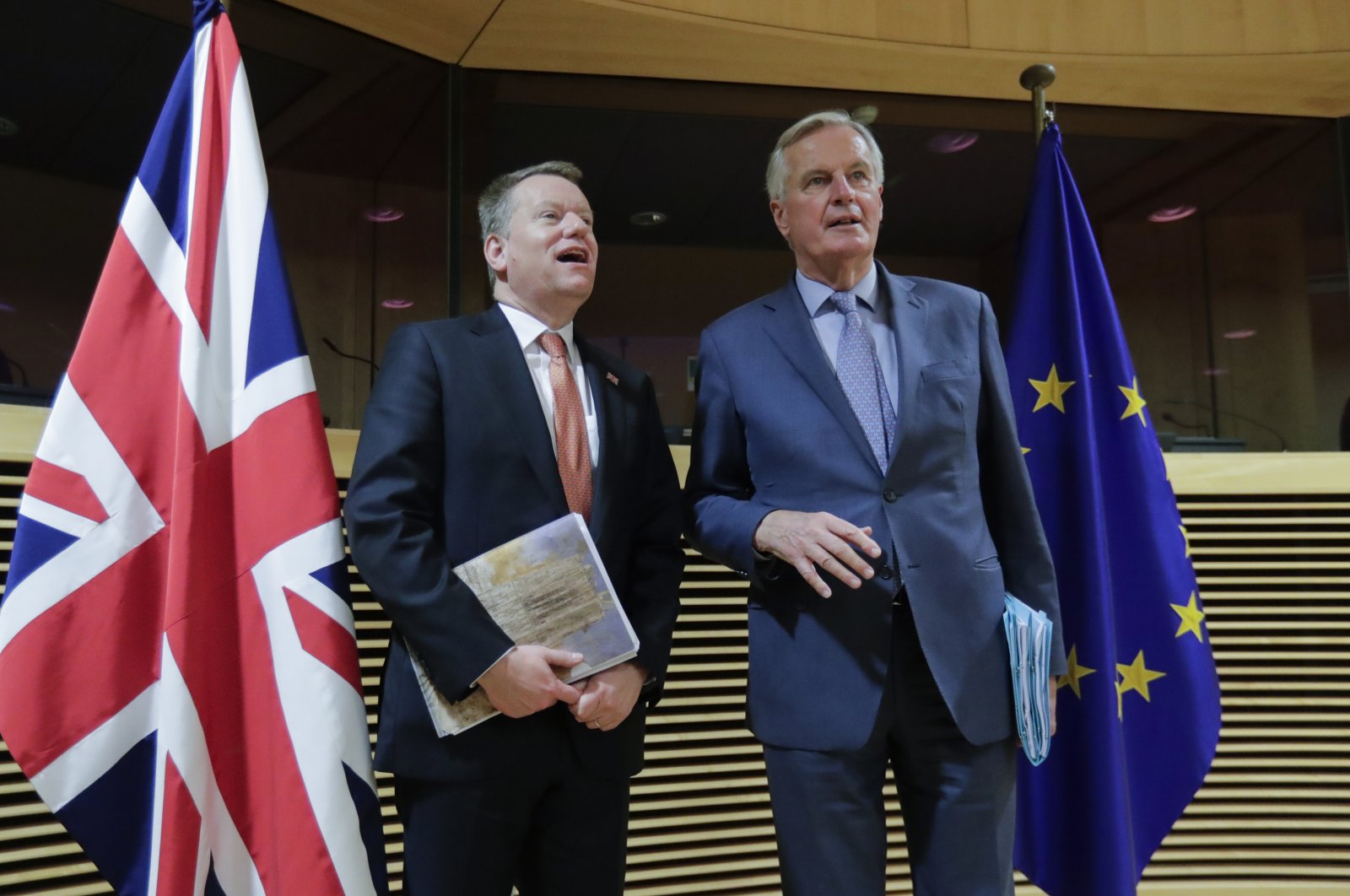 European Commission's Head of Task Force for Relations with the United Kingdom Michel Barnier, right, speaks with the British Prime Minister's Europe adviser David Frost at EU headquarters, Brussels, March 2, 2020. (AP Photo)
