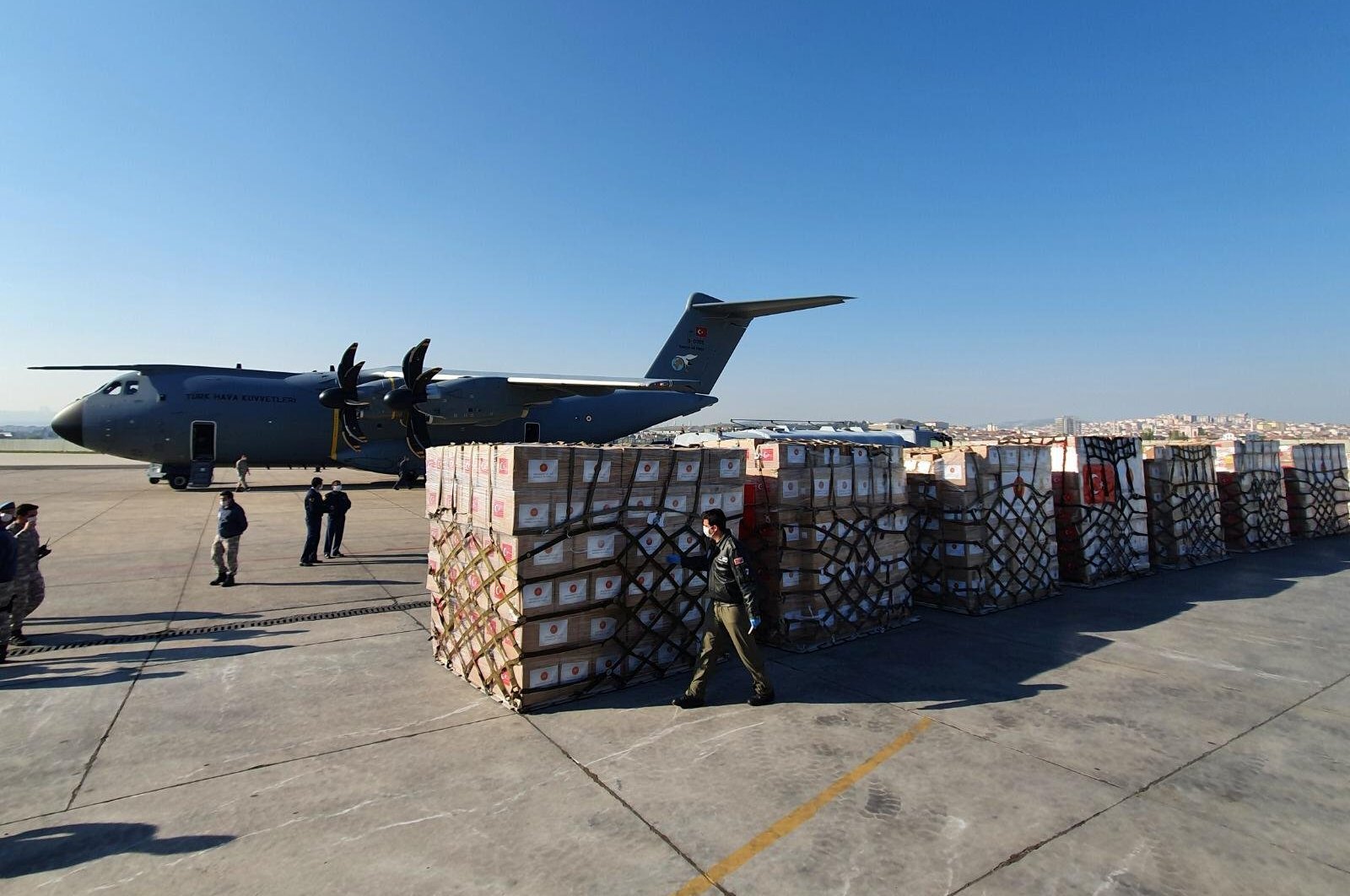 A Turkish military cargo plane and a shipment of medical supplies, part of a major aid campaign by Turkey which has dispatched supplies to dozens of countries since the coronavirus pandemic erupted, are seen at Etimesgut airport before departing for the United States, Ankara, April 28, 2020. (REUTERS Photo)