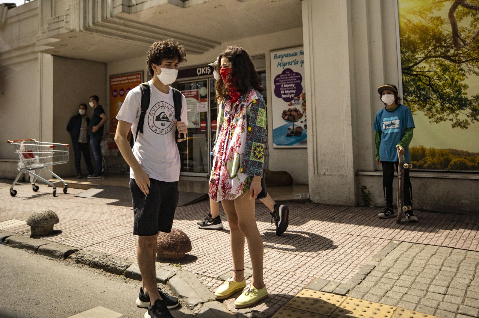 Two teenagers enjoy a day outside after youth ages 15 to 20 were allowed to go out for a limited time as part of eased coronavirus restrictions, Istanbul, Turkey, May 15, 2020. (AA Photo)