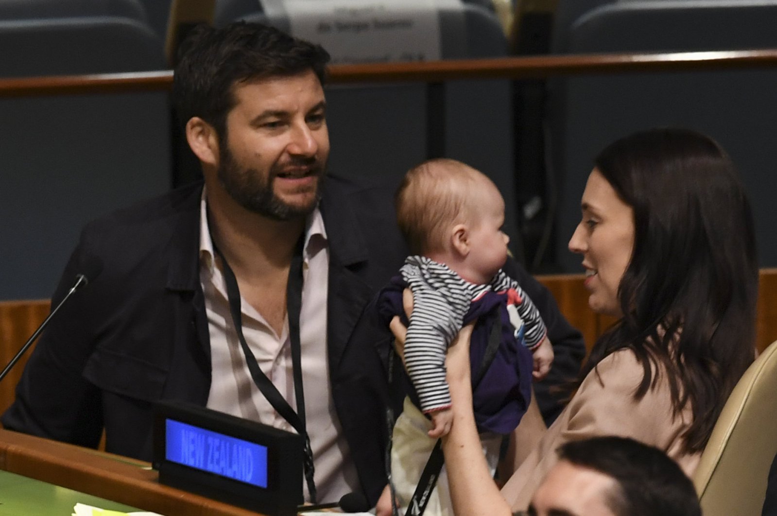 Jacinda Ardern, Prime Minister of New Zealand holds her son Neve Te Aroha Ardern Gayford, as her fiance Clarke Gayford looks on during the Nelson Mandela Peace Summit September 24, 2018, at the United Nations in New York. (AFP Photo)