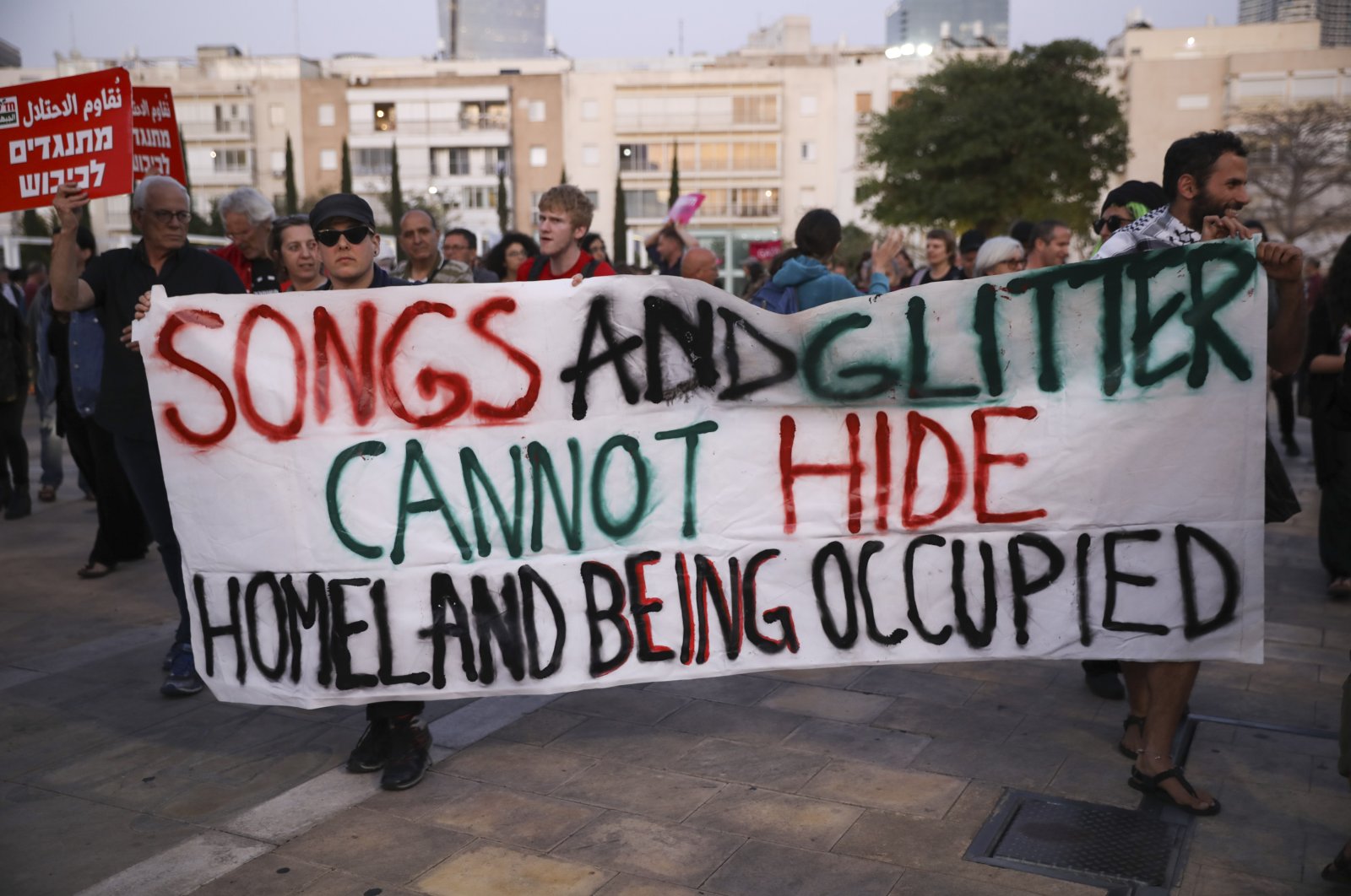 Peace activists call for lifting the Gaza blockade and to boycott the ongoing Eurovision Song Contest in Tel Aviv, Israel, May 14, 2019. (AP Photo)