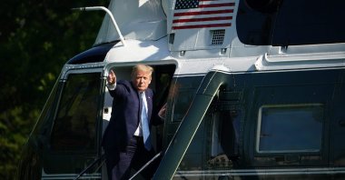 U.S. President Donald Trump waves as he boards Marine One before departing from the South Lawn of the White House in Washington, D.C., May 15, 2020. (AFP Photo)