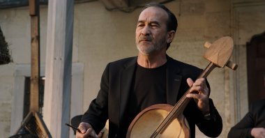 Kazakh singer Arslanbek Sultanbekov plays dombra. (AA Photo)