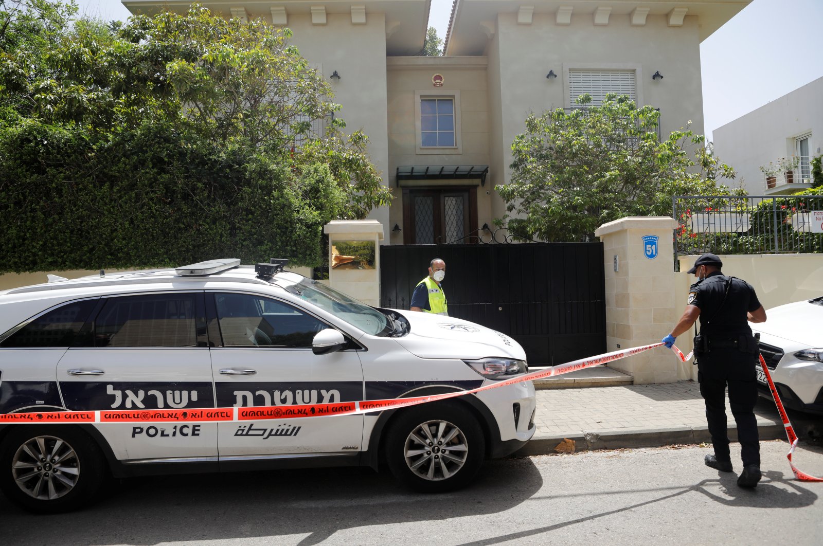 An Israeli policeman cordons off an area near the house of China's ambassador to Israel, Du Wei, in Herzliya, near Tel Aviv, Israel May 17, 2020. (Reuters Photo) 