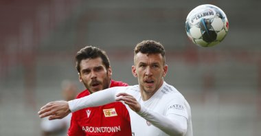 Bayern Munich's Ivan Perisic in action with Union Berlin's Christopher Trimmel during the match in Berlin, Germany, May 17, 2020. (AP Photo)