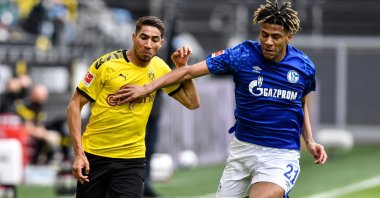 Dortmund's Achraf Hakimi vies for the ball with Schalke's Jean-Clair Todibo during a Bundesliga match in Dortmund, Germany, May 16, 2020. (AFP Photo)