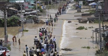 Flood-affected villagers move to safer places in the Narpatganj Block of the Araria district, Bihar, India, Aug. 14, 2017. (AP Photo)