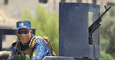 Members of the Iraqi security forces wearing protective masks keep watch at Tahrir Square, Baghdad, May 14, 2020. (AFP Photo)