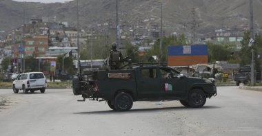 Afghan security forces inspect the site of a bomb explosion in Kabul, Afghanistan, Monday, May 18, 2020. (AP Photo)