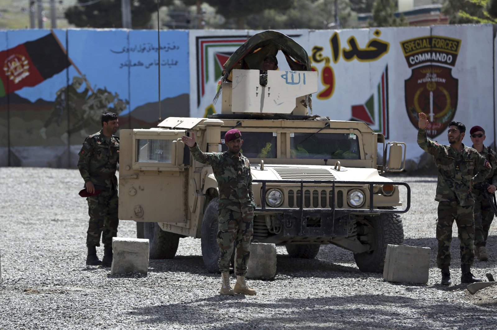 Afghan special forces stand guard near the site of a suicide bomber attack on the outskirts of Kabul, Afghanistan, Wednesday, April 29, 2020. (AP Photo)