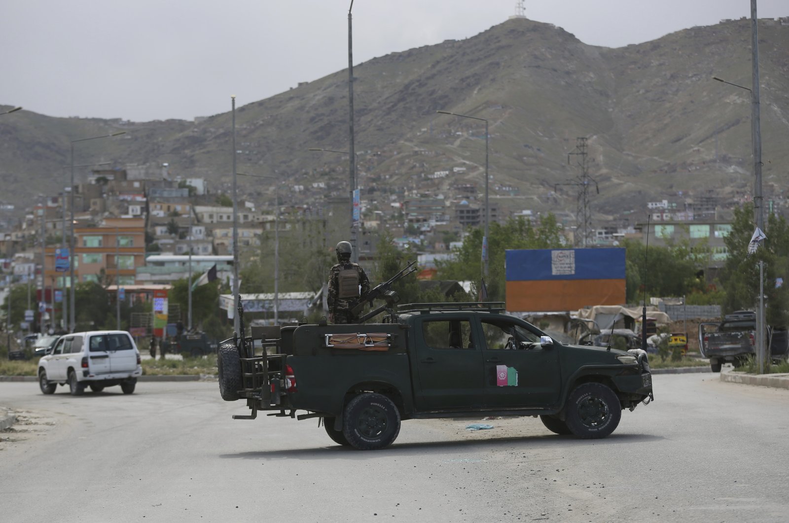 Afghan security forces inspect the site of a bomb explosion in Kabul, Afghanistan, Monday, May 18, 2020. (AP Photo)