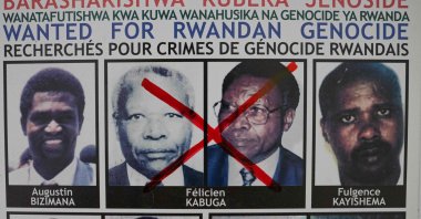A red cross is seen drawn on the face of Felicien Kabuga, one of the last key suspects in the 1994 Rwandan genocide, on a wanted poster at the Genocide Fugitive Tracking Unit office in Kigali, Rwanda, May 19, 2020. (AFP)