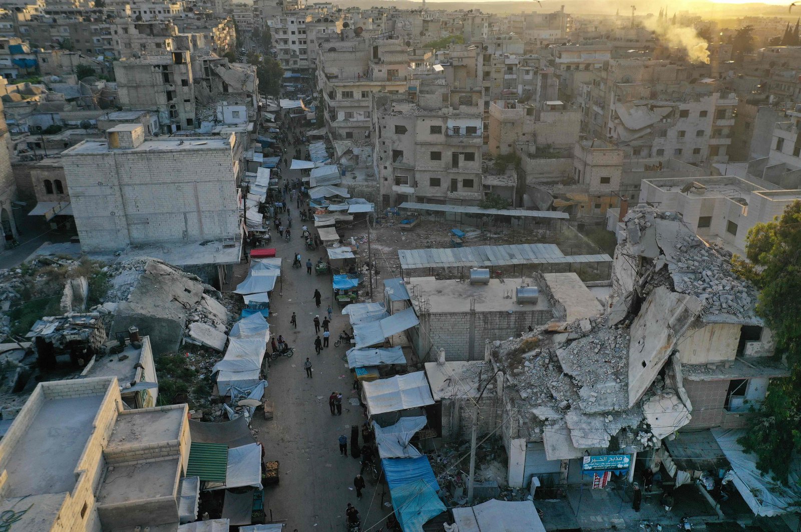 This picture taken on May 15, 2020 shows an aerial view of a market street (with heavily damaged buildings nearby) in Ariha in the southern countryside of Syria's Idlib province. (AFP Photo)