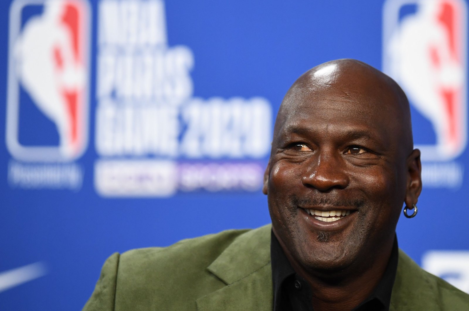In this file photo former NBA star and owner of Charlotte Hornets team Michael Jordan looks on as he addresses a press conference ahead of the NBA basketball match between Milwaukee Bucks and Charlotte Hornets at The AccorHotels Arena in Paris on January 24, 2020. (AFP Photo)