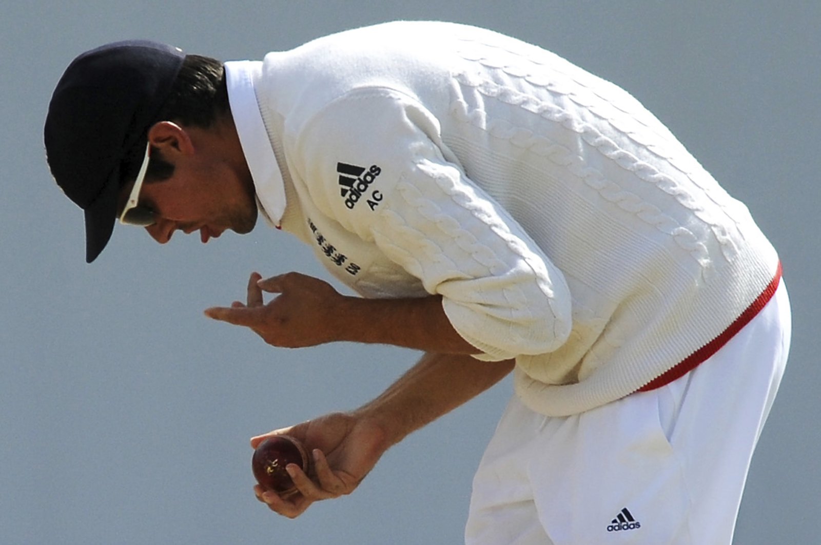 In this July 30, 2015, file photo England captain Alastair Cook polishes the ball during their Ashes Test cricket match against Australia in Birmingham, England.  (AP Photo)