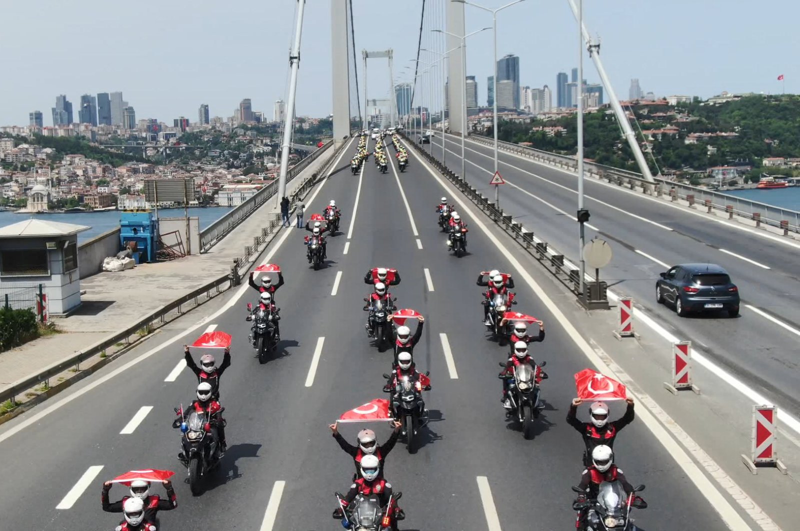 A Turkish police cortege takes place on the Bosporus Bridge, which is almost empty due to the four-day curfew imposed as part of the coronavirus struggle, Istanbul, Turkey, May 19, 2020. (DHA Photo)