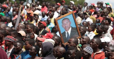 A supporter holds a picture of Agathon Rwasa, presidential candidate of the main opposition party the National Congress for Liberty (CNL), during the last day of the campaign in Gitega, central Burundi, May 17, 2020. (AFP Photo)