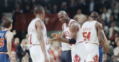 Michael Jordan (23) laughs, with teammate Horace Grant (54) in the background, during an NBA match in Chicago, Illinois, U.S., May 28, 1992. (AP Photo)