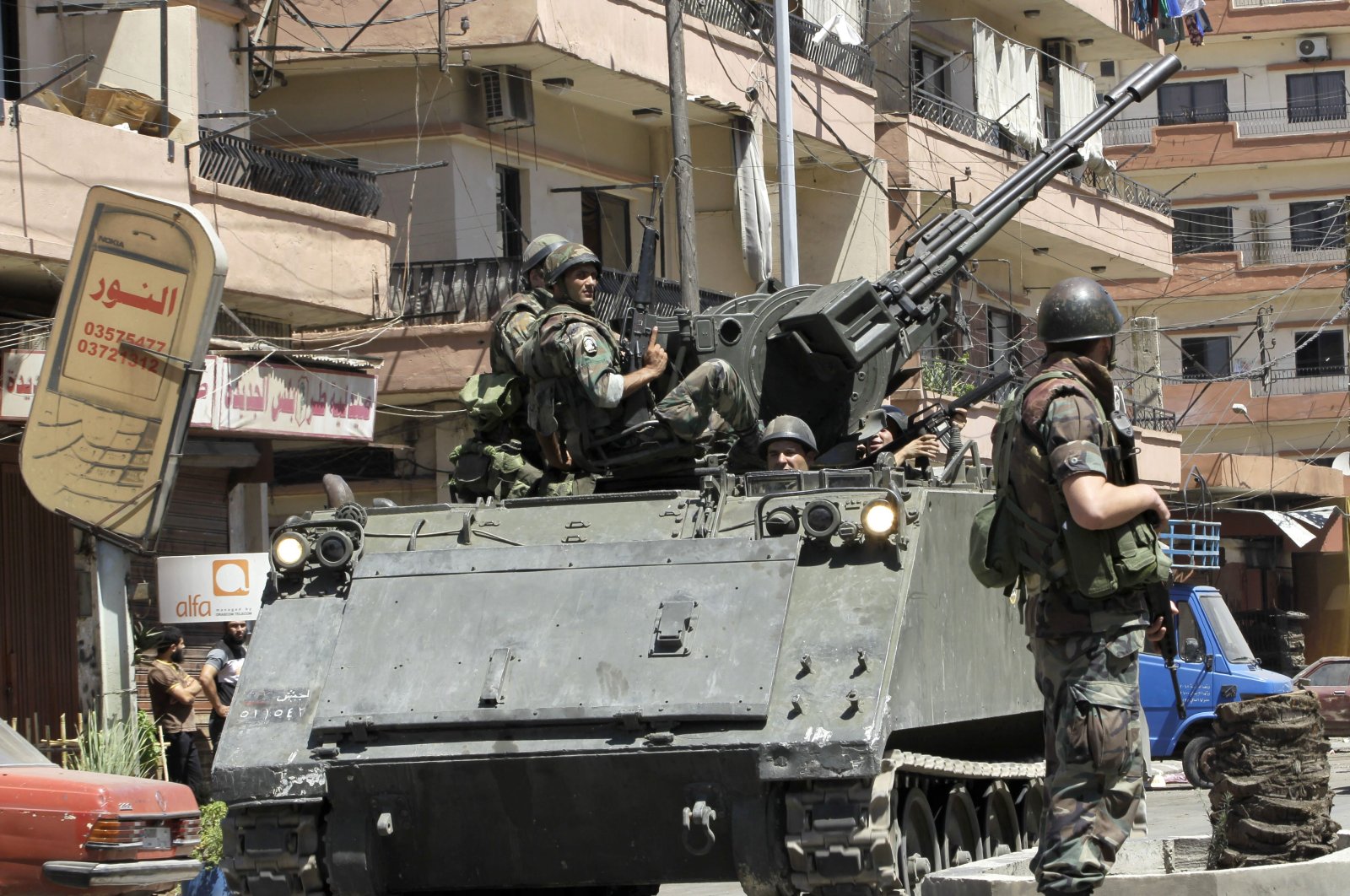 Lebanese army soldiers patrol after days of clashes between pro and anti-Syrian regime groups, in the northern city of Tripoli, Lebanon, Aug. 23, 2012. (AP Photo)