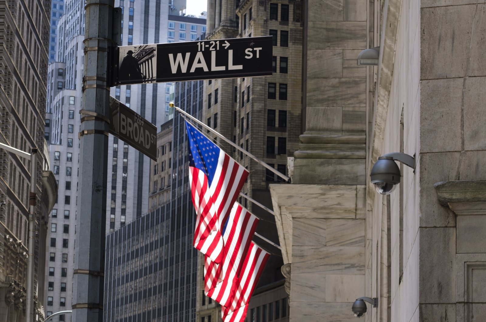 A view of a sign for Wall Street and the New York Stock Exchange in New York, New York, USA, 20 May 2020. The New York Exchange is set to reopen its trading floor next week after being closed since March due to the coronavirus pandemic. (EPA Photo)