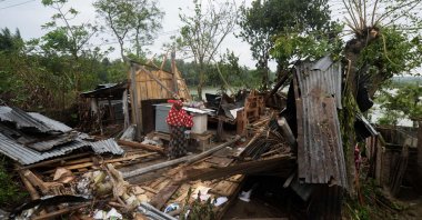 A woman stands amidst the debris of her house damaged by Cyclone Amphan in Satkhira, Bangladesh, May 21, 2020. (AFP Photo)