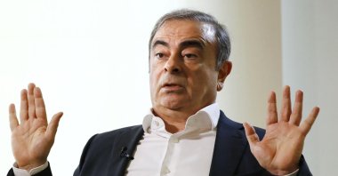 Former Nissan Chairman Carlos Ghosn speaks to Japanese media during an interview in Beirut, Lebanon, Jan. 10, 2020. (Kyodo News via AP)