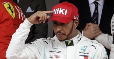 Lewis Hamilton points to his hat in a tribute to Niki Lauda after winning the Monaco Formula One Grand Prix race, in Monaco, May 26, 2019. (AP Photo)