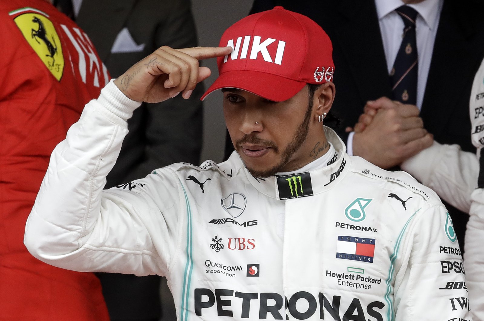 Lewis Hamilton points to his hat in a tribute to Niki Lauda after winning the Monaco Formula One Grand Prix race, in Monaco, May 26, 2019. (AP Photo)