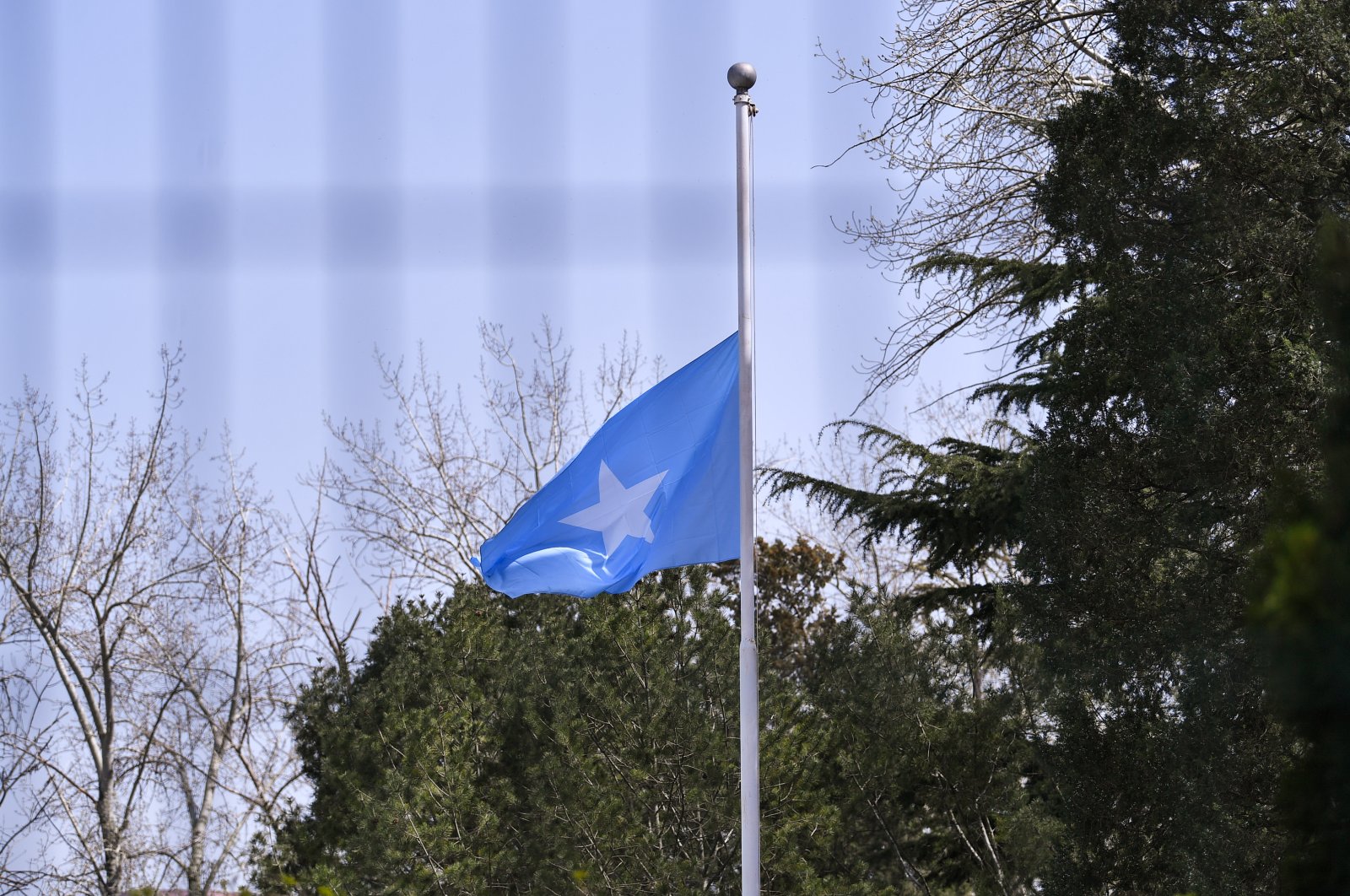 A Somalia flag is lowered to half mast to mourn for the martyrs who died in the fight of COVID-19 in the Somalia embassy in Beijing, China, April 4, 2020. (Reuters Photo)