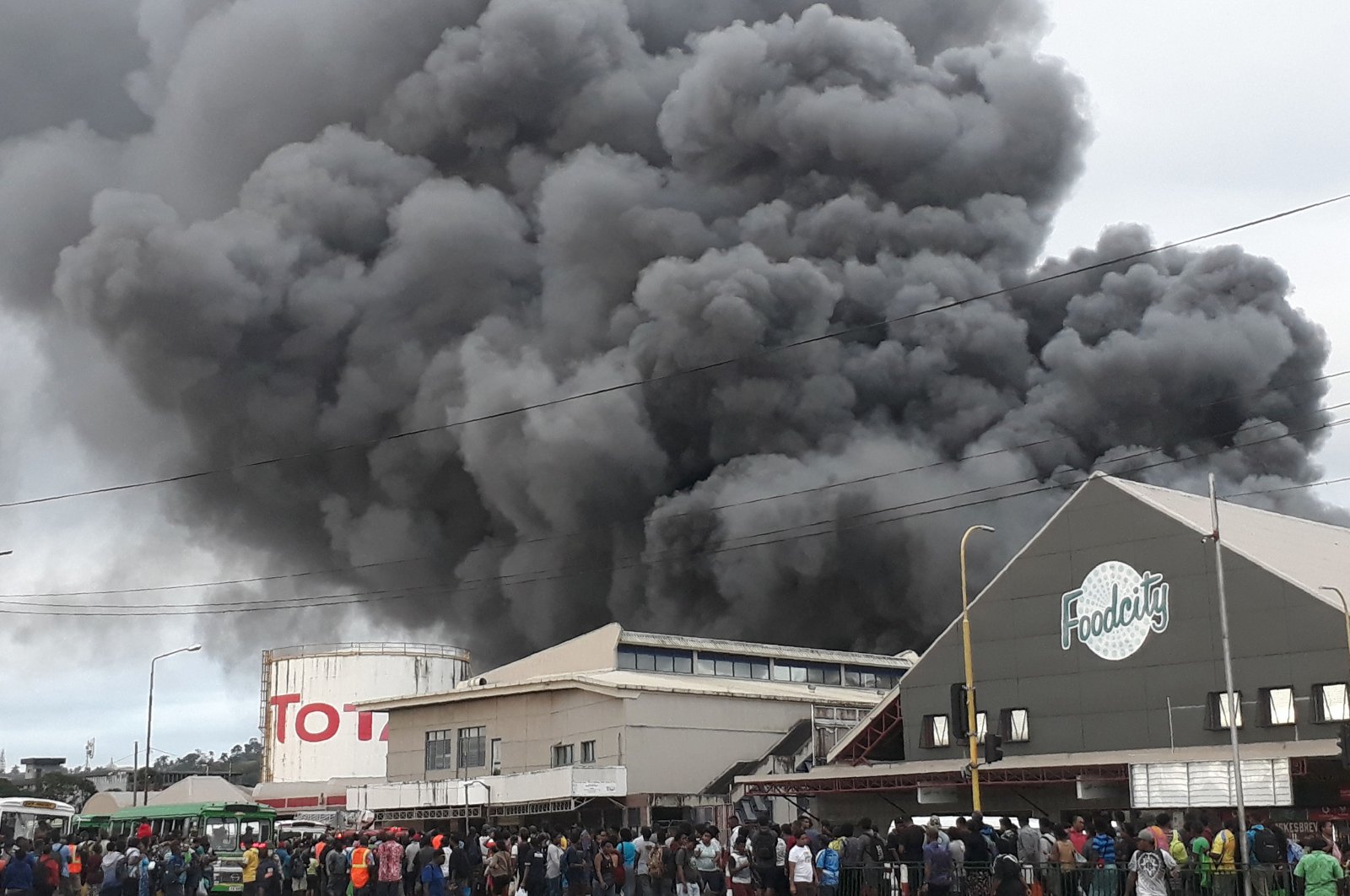 This handout photo released to AFP courtesy of Ropate Valemei and taken on May 22, 2020 shows thick smoke rising from a huge fire at one of Suva's largest markets in the Fijian capital before it was brought under control. (Courtesy of Ropate Valemei via AFP Photo) 