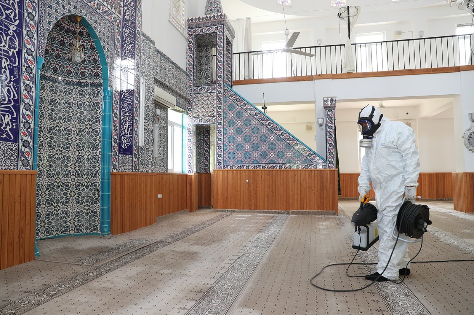 A worker disinfects a mosque in Denizli, Turkey, May 21, 2020. (İHA Photo) 