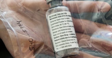 An ampule of remdesivir is displayed during a news conference at the University Hospital Eppendorf (UKE), Hamburg, Germany, April 8, 2020. (Reuters Photo)