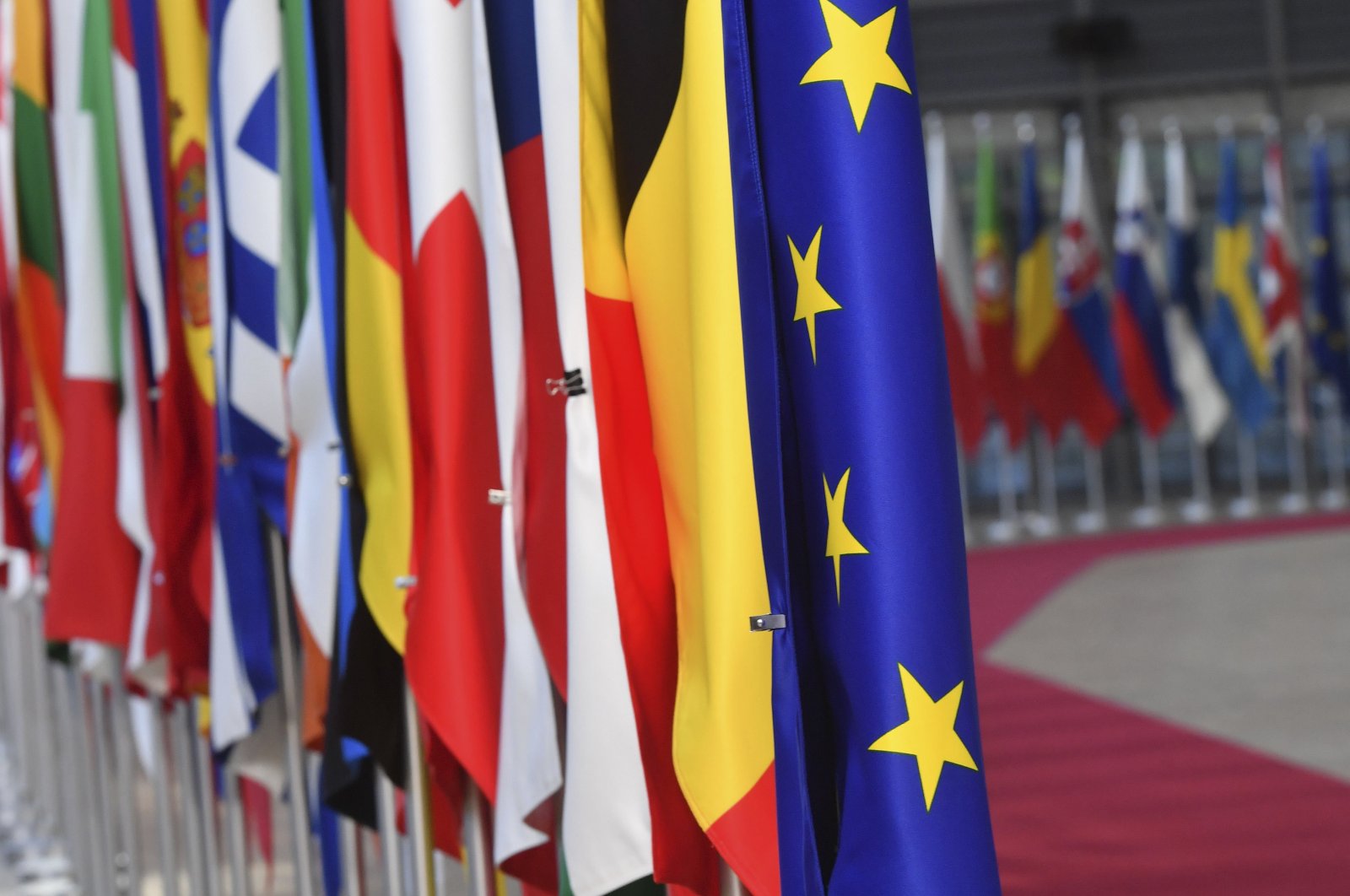 The European Union flag is displayed with EU member countries' flags at the European Council in Brussels, May 13, 2019. (AFP Photo)