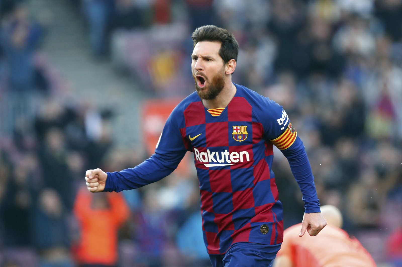 In this Saturday, Feb. 22, 2020 file photo, Barcelona's Lionel Messi celebrates after scoring his side's opening goal during a Spanish La Liga soccer match between Barcelona and Eibar at the Camp Nou stadium in Barcelona, Spain. Spanish Prime Minister Pedro Sánchez announced Saturday, May 23, 2020 that the soccer league in Spain will be allowed to resume from June 8. (AP Photo/Joan Monfort, File)