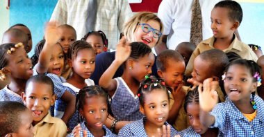 Nur Sağman, deputy general director for Africa at the Turkish Foreign Ministry, alongside with African children. (AA)